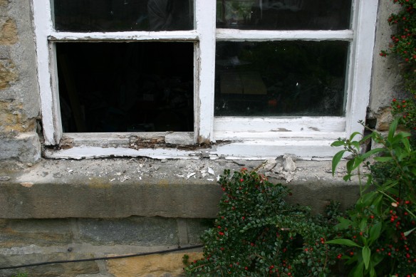 Window before repair work commences – window sills, bottom rail and lower frames are decayed.