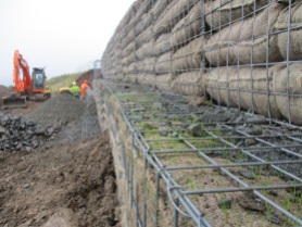Rosedale landslip repairs autumn 2016 - grass seed germinating in bags at front of gabions. Copyright NYMNPA.