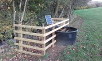 Solar water pump and trough installed. Copyright NYMNPA.